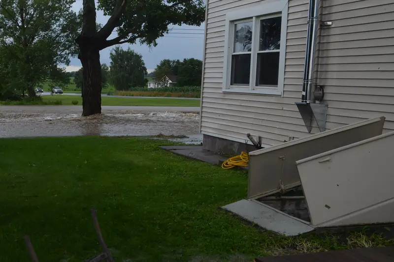 Flood water beside an open cellar door