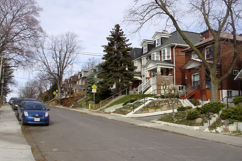 Tree-lined Toronto street of brick houses